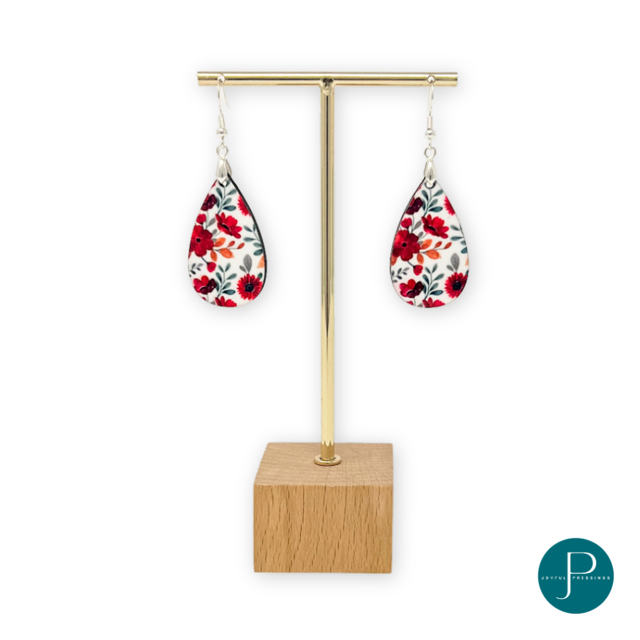 Red teardrop earrings on display.