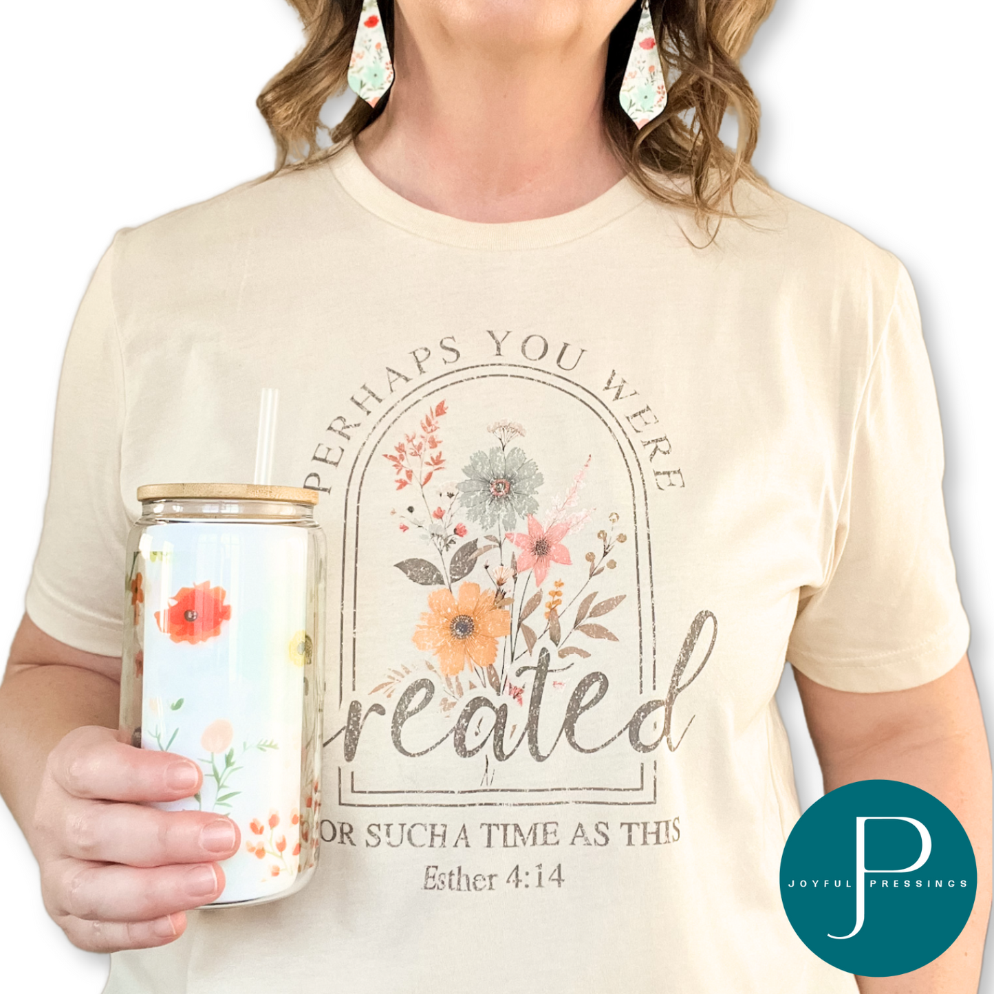 Model showcasing Created Bundle. 
 Includes Created T-shirt, matching floral earrings and glass floral tumbler