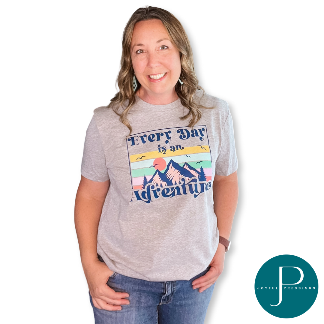 Everyday is an Adventure colorful print on a gray tee.  Displayed on a model..