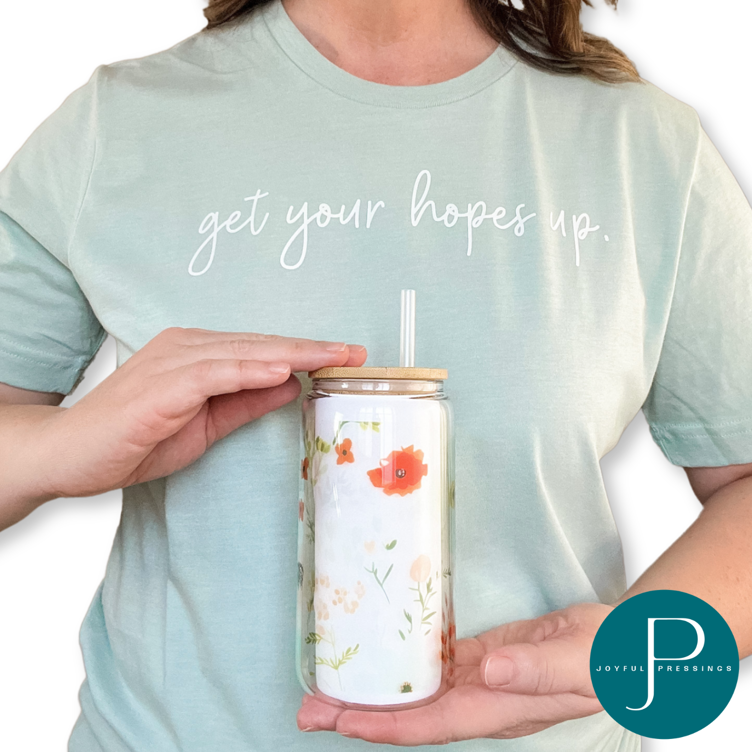 Model holding spring floral glass  tumbler.