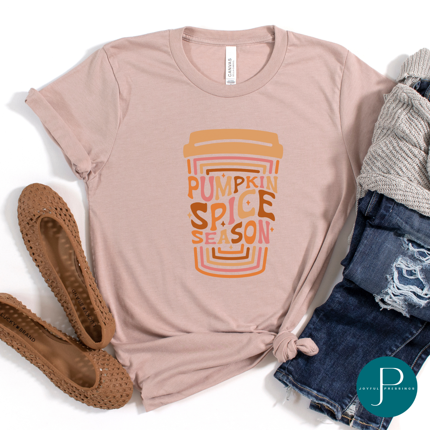 Flatlay of Pumpkin Spice Season t-shirt displayed.