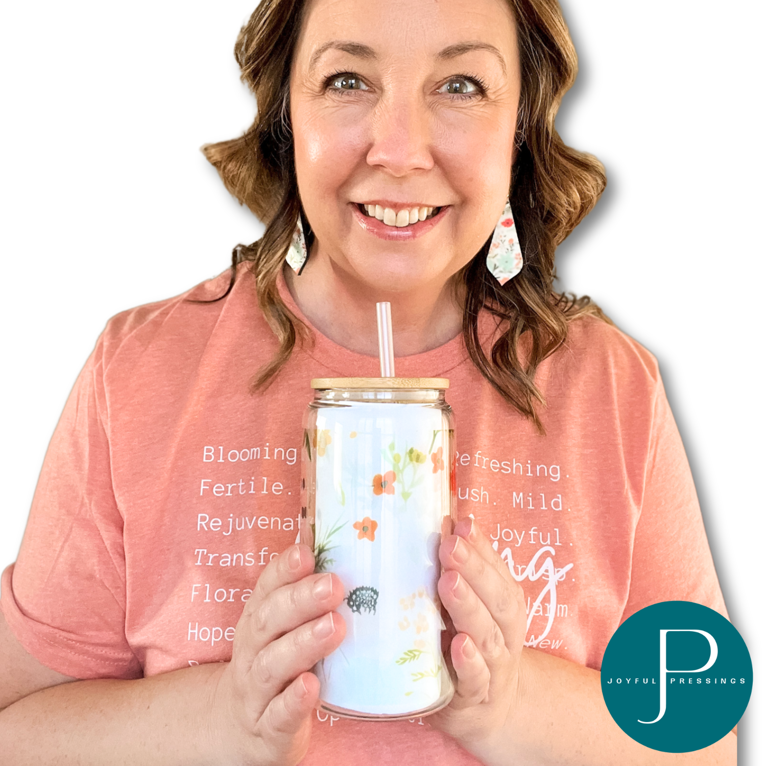 Model showcasing Spring Bundle  including t-shirt, earrings and glass tumbler.