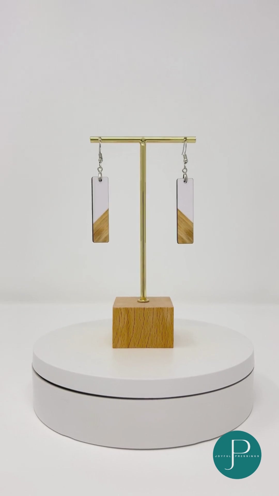 video of white and wood bar earrings